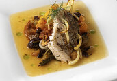 Wild Striped Sea Bass Roasted with Fennel, Sweet Onion, Heirloom Tomatoes and California Golden Raisins