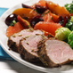 Garlic-Rosemary Pork Tenderloin with Fruit Compote Over Greens